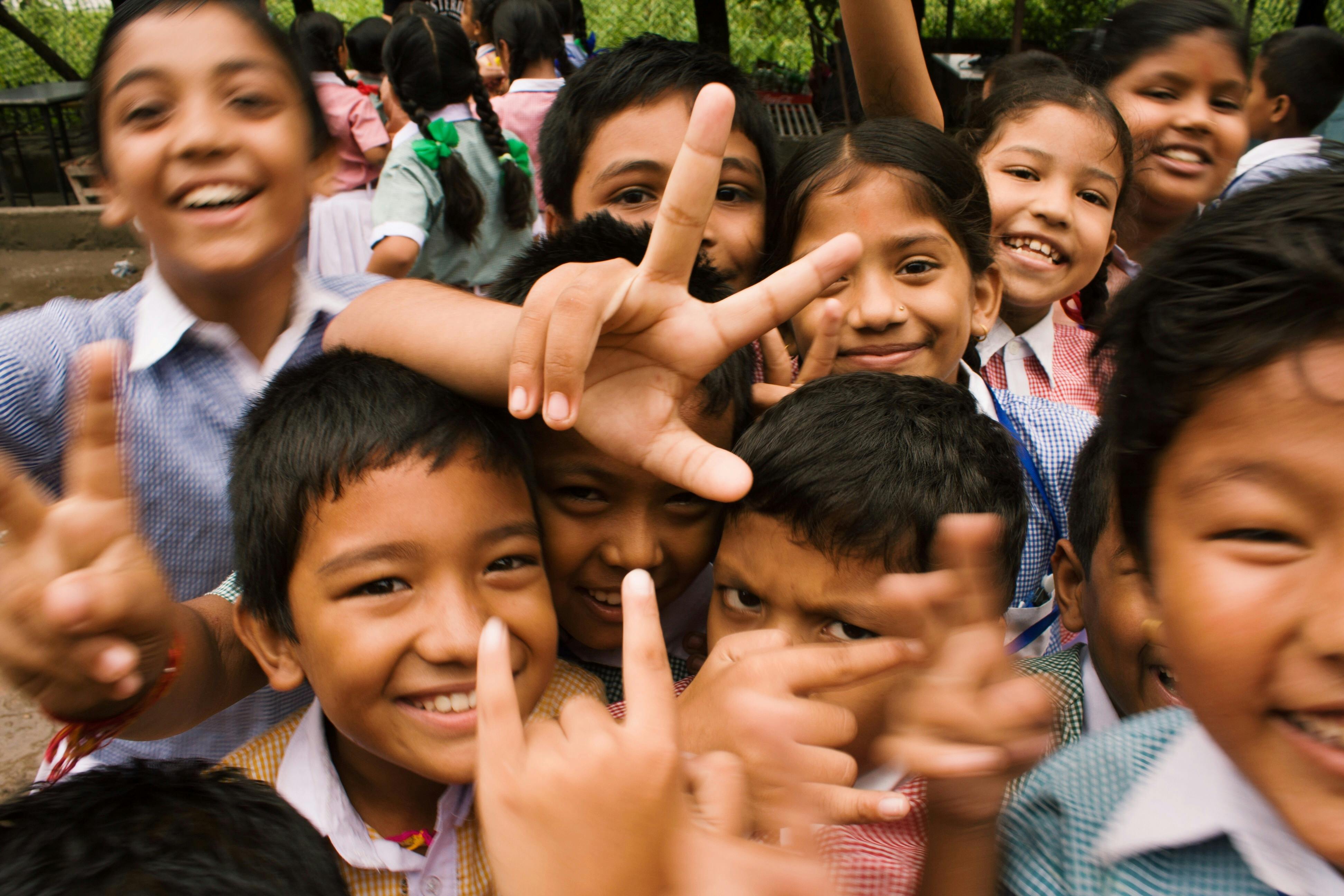 Joyful children making peace signs
